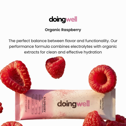 DoingWell Raspberry product card featuring the doingwell logo, "Organic Raspberry" headline, and description text about the performance formula combining electrolytes with organic extracts, with a Raspberry stick pack surrounded by floating fresh raspberries on a light background